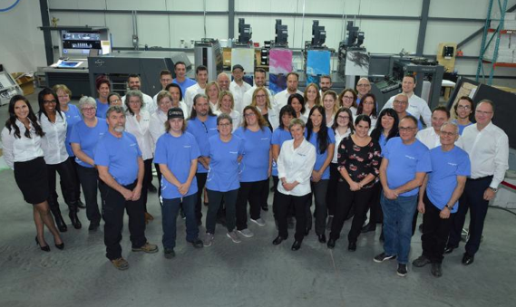 Staff in front of the new press