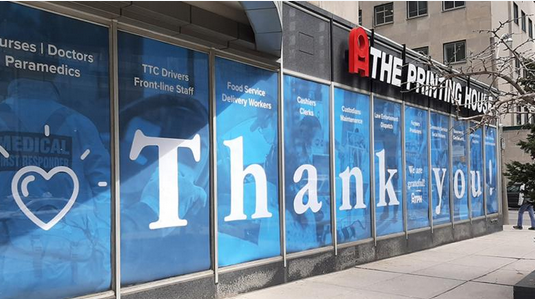 University Ave. store window signs thank Health Care Workers 