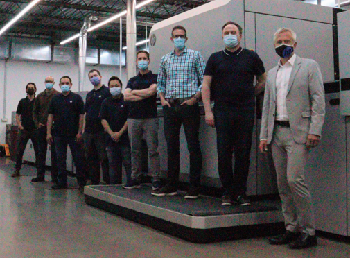 Staff in front of new HP Indigo 35K 