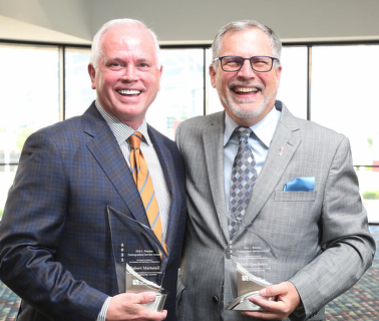 Robert Mattatall ( right) receives the International Sign Association Distinguished Service Award