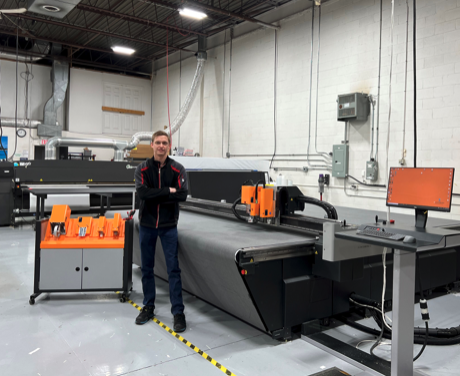 Kaleb Hosie, Vice President of Auto Trim DESIGN, with the Kongsberg C64.