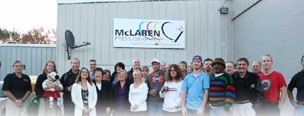 McLaren Press staff in front of plant 