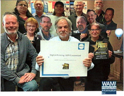 Brian Greenspan, President, of Wam International with Staff and Award 