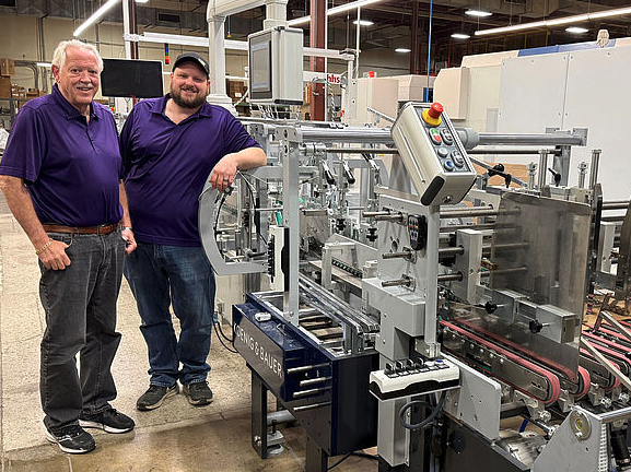 L to R: Jerry Theoret, Battlefield’s CEO; and Matt Theoret, Battlefield’s vice president of manufacturing and Allpro 110 folder gluer.